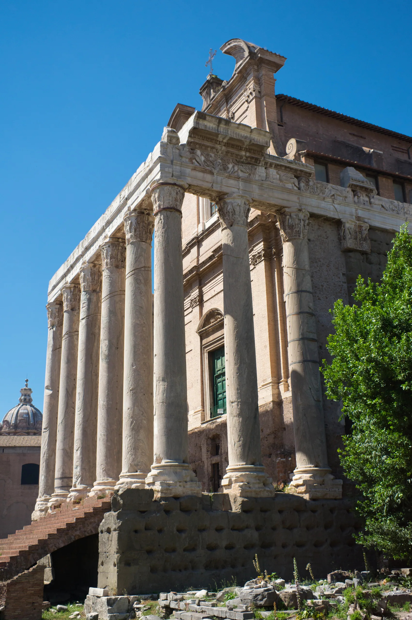 The columned portico of the Temple of Antoninus and Faustina in the Forum, its architrave inscription still legible.