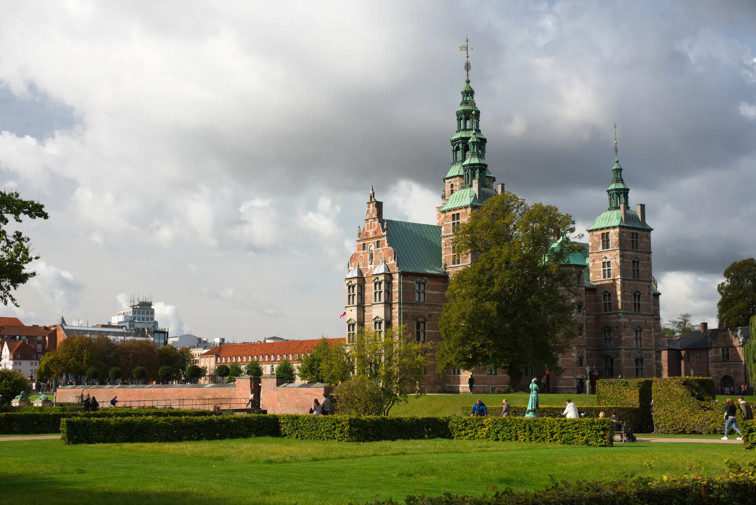 Rosenborg Castle with its green copper spires seen across the clipped lawns and hedges of the King's Garden.